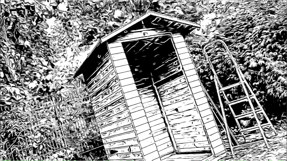 Schwarz/Weiß Bild einer aufgebauten Holzhütte